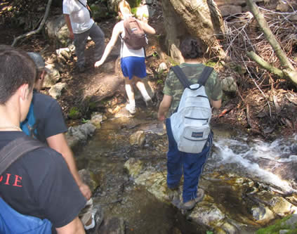 group crossing stream